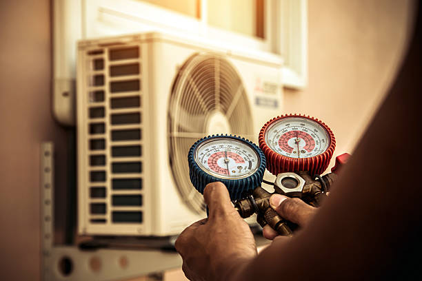 Professional Air Conditioning Service technician working in Spring Valley, IL